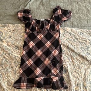 It’s a black and red plaid dress